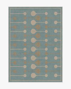 a blue and beige rug with circles on it