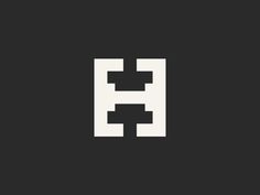 the letter h is made up of squares and rectangles in black and white