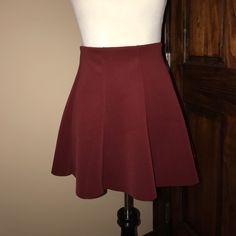 Size Medium. A-Line. Scuba Material. Maroon Color. Mini. Elasticize Waist. New With Tags Fitted Burgundy Pleated Skirt, Fitted Zara Mini Skirt, Zara Fitted Mini Skirt, Fitted Lined Burgundy Mini Skirt, Fitted Burgundy Lined Mini Skirt, Fitted Zara Skort In Solid Color, Fitted Short Skirt By Zara, Zara Stretch Skort With Lined Skirt, Zara Pleated Fitted Mini Skirt