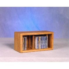 a wooden box with dvd's in it