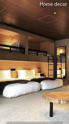 a bedroom with bunk beds and white pillows