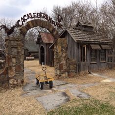 an old fashioned wagon is parked in front of the entrance to a building with a sign that says cracker bank on it