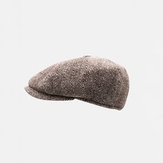 This 8-panel wool newsboy cap model protects your head from the cold in autumn-winter days thanks to its fabric structure and provides excellent thermal comfort. It completes your smart casual and daily style in autumn-winter days. You should choose your head size S-M (55-56cm), M-L (57-58cm) or L-XL (58-59cm) according to your head size. We recommend that you measure your head from your forehead (above the ears) for a perfect fit. The main component is woven wool & cotton fabric, the inner lining is satin quilted and the inner component of the visor is polyester. There is a band on the inside to adapt to your head circumference. It provides protection from the harmful rays of the sun. Colors may show slight tone changes due to light differences in studio shots. SEND AS GIFT: If you need g Paperboy Hat, Handmade Brown Flat Cap, Brown Military Style Flat Cap, Vintage Herringbone Cap, Brown Wool Flat Cap, Peaky Blinders Hat, Adjustable Tweed Flat Cap, Winter Flats, Gatsby Hat