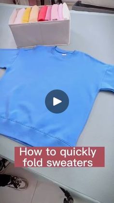 a blue sweatshirt with the words how to quickly fold sweaters on it and an image of