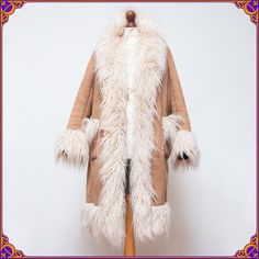 The ultimate 70s style Penny Lane afghan coat of our DREAMS 🖤😍 Definitely much more stunning in person!! Size M ⫸ Super shaggy fur made from faux Mongolian lamb ⫸ Condition: Amazing condition! Without any stains or odors. Please see the pictures ❀ Don't       hesitate to contact me if you would like to see more pictures or have any questions. ⫸ mid-weight, warm & snuggly ⫸ Ultra soft and cozy ⫸ The fluffiest, long & curly faux mongolian fur trim ⫸ Fully lined with faux shearling ⫸ Fabric: poly Afghan Coat, Mongolian Lamb, Mongolian Fur, Coat Vintage, Penny Lane, 70s Style, 70s Inspired, Long Curly, 70s Fashion