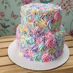 a cake that is sitting on top of a table with the words, this baker's pastel cake creations will give you magic unicorn vibes