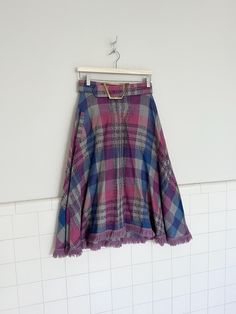 the most amazing 1970s lily montez skirt. features a plaid print, chunky belt with brass buckle and a pocket in right  hip. in amazing vintage condition with no rips tears or stains.  waist 27.5 length 28' hips free Chunky Belt, Plaid Midi Skirt, Womens Skirts, Charity Shop, Skirt Belt, 2023 Autumn, Midi Skirts, Brass Buckle, Plaid Print