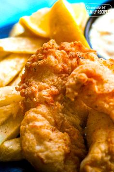 fried fish and chips on a blue plate