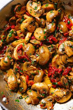 a pan filled with cooked mushrooms and peppers