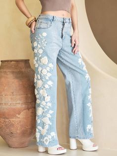 Western meets romantic in these show stopping jeans. Elevate your denim game with these funky jeans, boasting a high-rise, baggy straight fit. Unique embroidery and paneling on the sides add cool dimension. Complete with a button-front closure, five pocket design, and rigid denim fabrication. These jeans are no joke. They're absolute head-turners. The fit is loose and they have a long, striking length unless you have a long inseam or are over 5' 6" plan to have them hemmed for the perfect fit. High Rise Baggy Jeans, Funky Jeans, Scarf Coverup, Sorority Recruitment Outfits, Unique Jeans, Rebecca Black, Recruitment Outfits, Unique Embroidery, Romper And Jacket