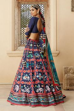 Blue lehenga with patola printed motifs and placement gota work. Paired with cutwork blouse and printed, embroidered dupatta.
Component: 3
Pattern: Printed, Embroidered
Type Of Work: Patola Print
Neckline: Sweetheart
Sleeve Type: Long Sleeves
Fabric: Silk
Color: Blue
Other Details: 
Patola print
Printed dupatta
Tassel detail
Occasion: Sangeet, Destination Wedding - Aza Fashions Fitted Blue Bohemian Lehenga, Bohemian Blue Choli With Cutdana, Bohemian Blue Lehenga With Cutdana, Blue Bohemian Traditional Wear For Wedding, Bohemian Blue Traditional Wear For Wedding, Blue Bohemian Lehenga With Traditional Drape, Blue Bohemian Lehenga With Dupatta, Blue Bohemian Wedding Sets, Blue Choli For Navratri And Traditional Ceremonies