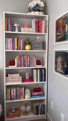 a white book shelf filled with lots of books