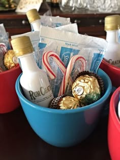 some candy and candies in blue bowls on a table