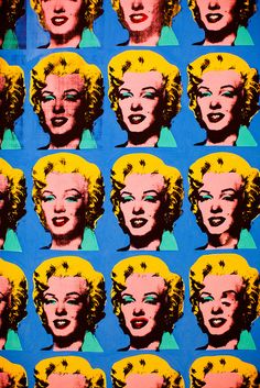 an image of marilyn monroe's face on blue background