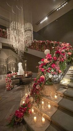 an elaborate staircase decorated with flowers and candles