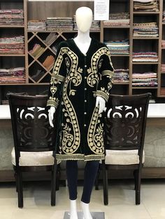 Never fading, the timeless traditional embroidered coat will make you look trendy and stylish no matter what. Pair it up with denim, skirt, trouser, or even a flowing dress to evoke chic in you.Product Details- Condition: Brand New (made to order)- Handmade- Style: Coat- Fabric: Fine Velvet- Embroidery: Dori & Tilla Work- Base Color: Green- Embroidery Color: Gold- Fully Lined from Inside- Features Pockets on both sides- Length: 42" (107 cms approx)- Care Instructions: Dry Clean Only**If you Traditional Velvet Long Sleeve Outerwear, Traditional Long Sleeve Velvet Outerwear, Fitted Green Outerwear With Resham Embroidery, Fitted Winter Outerwear With Gold Embroidery, Winter Outerwear With Gold Embroidery And Long Sleeves, Embroidered Green Outerwear For Winter, Embroidered Green Winter Outerwear, Festive Velvet Long Sleeve Outerwear, Festive Winter Outerwear With Gold Embroidery