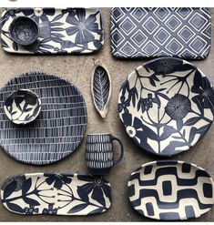 blue and white dinnerware with an intricate design on the plates, cups and spoons