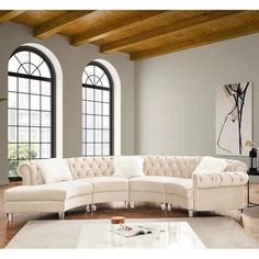 a large white sectional couch in a living room