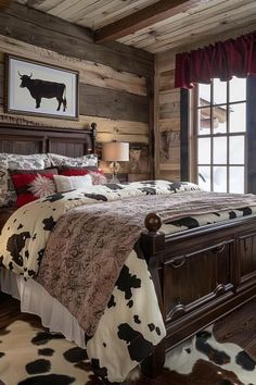 a cow print bed spread in a rustic bedroom