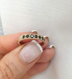 Handmade delicate Black Onyx, half eternity stacking ring, stoned with 7 beautiful shiny Onyx, diamond shaped faceted gemstones.  This multistone eternity ring is beautiful alone or stacked together with other rings and is delicate and pretty on your finger.  The ring is available in nickel free, 14k gold plating over brass or silver base as well as, solid silver or 9k and 14k solid gold- yellow, white or rose gold. A perfect engagement ring or just a beautiful gift for you. Gemstones alternative include garnet, sapphire, tourmaline ruby citrine and peridot. Dimensions: The ring width is about 2 mm. Multiple ring sizes are available. If you need an additional different size just convo me. For other rings I make: https://www.etsy.com/il-en/shop/EfratMakovJewelry?ref=listing-shop2-all-items- Anniversary Ring With Black Diamonds In Round Band, Black Stackable Round Cut Rings, Black Fine Jewelry Rings For Everyday, 14k Gold Open Ring Stackable Half Eternity Rings, Black Minimalist Stackable Rings For Anniversary, Black Stackable Rings With Round Band For Gift, Everyday Black Fine Jewelry Ring, Dainty Black Stackable Jewelry, Minimalist Black Stackable Rings With Round Band