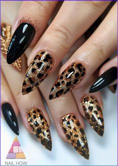 Elevate your nail game with this glamorous black and gold leopard print nail design. The perfect combination of bold and chic for any fashionista looking to make a statement. Get inspired and find more luxurious nail art at NailHow.com. Leopard Glitter Nails, Leopard And Black Nails, Animal Design Nails, Black And Leopard Print Nails, Animal Print Nail Art Leopards, Black Gold Nails Designs, Black Cheetah Print Nails, Nail Designs Leopard Print, Black And Gold Gel Nails