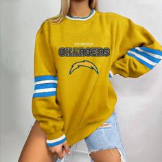 Opt for a classic look with this American Football Sweatshirt!

 This American football logo hoodie is casual and loose . It has a crew neck , striped sleeves , oversized to give a unique and sporty look. It offers a trendy and casual look that adapts to the needs of modern women. Comfortable and with a timeless design, this piece revisits the sporty style with a feminine touch. Treat yourself to this women's hoodie to get a chic and casual look that will accompany you wherever you go!





 Material: Cotton

 12 models available




 High quality finish

 Free Shipping




 ✂ SIZE GUIDE (cm) 












 Size


 Shoulder


 Bust


 Sleeves


 Length 






 S

 43

 106

 59

 67 






 M

 45

 112

 61

 69 






 L

 47

 117

 62

 71 






 XL

 48

 123

 63

 73 






 2XL Sweat Vintage, Style Sportif, Jean Vintage, Football Sweatshirt, Cozy Knit Sweater, Los Angeles Chargers, Chic Sweaters, Cozy Knit, Striped Sleeve