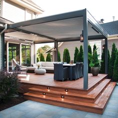 an outdoor patio with decking and lighting