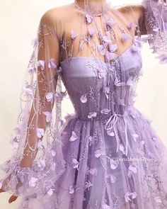 Details - Lavender color - Tulle fabric  - Embroidered purple flowers  - A-line gown with waist definition and long sleeves - For special occasions