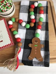 a table topped with candy and a gingerbread necklace