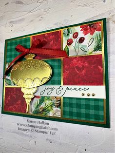 a close up of a card with a gold key and red ribbon on the front