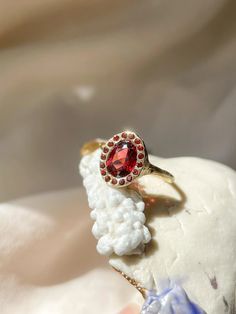 Heirloom Garnet Halo Ring – Margaux Perrier Jewelry Heirloom Ring, Heirloom Rings, Bridal Engagement Rings, Custom Bridal, Garnet Stone, Fine Jewelry Designers, Energy Crystals, Halo Ring, Halo Rings