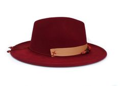 "The Ocotillo hat part of the Tucson Collection Type: Center Dent Wide Brim Fedora Adjustable Size: With a tie of a knot, adjust the fit of your hat to the ideal size from 21 ¼ to 23 ¼ inches. Dimensions: Wired Brim: 2 7/8\", Crown: 4\" Color: Distressed Burgundy, Sun bleached for 32 hrs. Materials: 65% Cotton , 35% Polyester Grosgrain Ribbon Custom Shadow & Growth Bead Collection of Texas Mountain Laurel seeds & Mesquite Screw Beans. Natural Leather cord & Bone beads Origin: All of Adjustable Burgundy Hat For Fall, Adjustable Burgundy Fall Hat, Adjustable Burgundy Felt Hat With Curved Brim, Adjustable Burgundy Flat Brim Hat, Adjustable Burgundy Felt Hat With Flat Brim, Adjustable Burgundy Brimmed Felt Hat, Burgundy Fedora, Texas Mountain Laurel, Green Zone