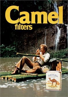 a man sitting on top of a raft next to a box of camel filters in the water