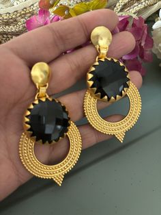 Simply Stylish and Elegant! A gorgeous pair of earrings for the gemstone's lovers! Purely handmade with love by our skilled Indian craftsmen from Jaipur  Dimensions: Weight per Pair:  34 grams Length of earrings: 7 cm Width of earrings: 4 cm  Product Details: Material: Handcrafted in brass with a gold-plated base and natural gemstones.  Black onyx Elegant Metal Earrings For Gift, Elegant Round Danglers As Gift, Elegant Danglers As A Gift, Elegant Clip-on Earrings With Latkans As Gift, Elegant Gemstone Danglers For Gift, Elegant Latkans Clip-on Earrings As Gift, Handmade Elegant Chandbali Earrings, Elegant Round Danglers For Gift, Elegant Handmade Chandbali Earrings