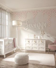 a baby's room with pink furniture and flowers on the wall, along with a white crib