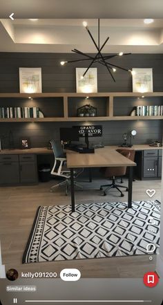 a home office with black and white decor