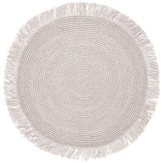 a round rug with fringes on it