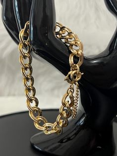 Very Pretty and in excellent condition , shiny gold plated , double look curve chain links, with safety chain and with large spring ring clasp unsigned. Measure 7 1/4" Ask questions if you have and thank you for coming. Luxury Vintage Jewelry With Double Chain, Formal Adjustable Cuban Link Bracelet, Vintage Yellow Gold Curb Chain Bracelet, Gold Metal Bracelet With Curb Chain, Gold Chain Cuban Link Metal Bracelet, Gold Cuban Link Bracelet With Chain Detail, Gold Metal Cuban Link Bracelet, Gold Bracelet With Curb Chain Link, Gold Cuban Link Bracelet With Chain