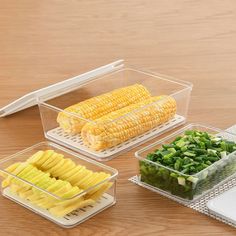 three plastic containers filled with food on top of a wooden table