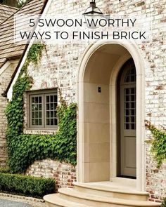 the front entrance to a brick house with ivy growing on it