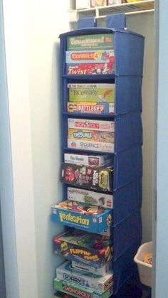 there is a blue tower that has many games on top of it in the corner