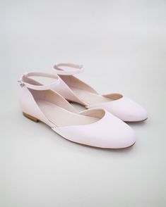 Inspired by a contemporary and refined ballet style flat. Classic silky satin round toe flat with removable ankle strap brings an elevated elegance and makes this a classy and elegant shoes for wedding, evening wear, or romantic date.DETAILS:UPPER: Synthetic upper and liningMATERIALS: Manmade outsoleHEEL HEIGHT: 0.5"Imported Material Luxury Pink Closed Toe Flats, Affordable Slip-on Formal Flats, Cheap Pink Round Toe Dance Shoes, Blush Bridal Shoes Flats, Elegant Flat Shoes Round Toe, Pink Wedding Flats For Bride, Shoes For Brides, Shoes For Wedding, Ballet Style