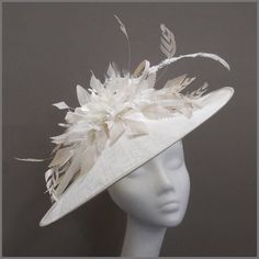 Stunning white and oyster disc fascinator (hatinator) decorated with fine loops of sinamay a beautiful assortment of feathers including trimmed ostrich quill, and a scattering of silver diamanté. Made on a headband.  This saucer style headpiece is ideal for race days / ladies day, weddings or formal functions. Please note this hat is made to order, orders take approximately 2-3 weeks to be made.  Designs can be made to order in a range of different colours or styles, see our colour chart: www.ja Edwardian Hat, Feather Fascinator, Wedding Hat, Wedding Fascinators, Feather Fascinators, Elegant Hats, Wedding Hats, Day Wedding, Race Day