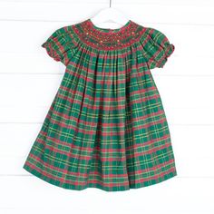 This Geometric Smocked Christmas Green Plaid Dress is the perfect holiday dress! Adorned with elegant red geometric smocking, this vibrant green and red plaid dress adds a touch of holiday charm. It's ideal for a Christmas card, a holiday party, or visiting Santa. Geometric Smocking, Christmas Loungewear, Green Plaid Dress, Girls Thanksgiving, Red Plaid Dress, Magnolia Baby, Black Friday Christmas, Christmas Green, Bubble Dress