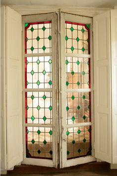 an open door with stained glass in the front and side panels on the back doors