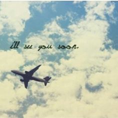 an airplane is flying in the sky with some clouds behind it and blue skies above