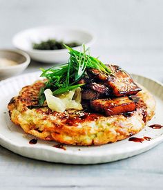 a white plate topped with food on top of a table