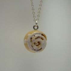 Super cute Cinnamon Bun necklace with Sterling Silver Chain!!! How cute is that!!!  These pendant measure approx. 0.5 inch in diameter. The necklace is approx. 18 inch long.  These products are made with many types of polymer clay, plastic, glass, metal, ceramic and much more. They are meant ... Cute White Nickel-free Necklaces, Cute White Nickel Free Necklaces, Cute Nickel-free Round Necklaces, Cute Resin Necklaces For Gifts, Adjustable Nickel Free Resin Necklace, White Round Resin Necklaces, White Resin Round Necklaces, Cinnamon Roll Keychain, Silver Kawaii Necklace For Gift