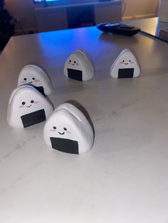 five little white objects sitting on top of a table