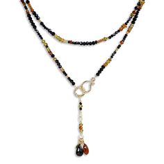 Gold & Stone Necklace - A gold clasp and beads highlight the array of spinel stones, hessonite and zircon in this multi-colored stone necklace. This unique necklace doubles as a gemstone bead bracelet. The total length of 33-34.5 offers 3 clasp options that are 1 inch apart, and the necklace can be worn long or wrapped for a layered look with the clasp in front. Amber Gemstone Beads Rondelle Jewelry, Amber Rondelle Gemstone Beads Jewelry, Elegant Amber Gemstone Beads, Elegant Amber Multi-stone Jewelry, Multi-strand Amber Jewelry With Gemstone Beads, Amber Multi-strand Jewelry With Gemstone Beads, Gold Stone Necklace, 2024 Jewelry, Silk Necklace